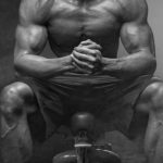 Fitness - Grayscale Photo of Man Sitting on Bench