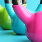 Kettlebell - Green, Blue, and Pink Kettle Bells on Blue Surface