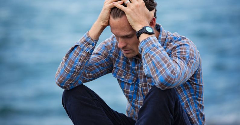 Pressure - Man in Blue and Brown Plaid Dress Shirt Touching His Hair