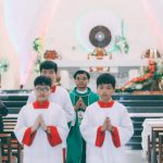 Practices - Priest and Altar Servers Performing Christian Ceremony in Church
